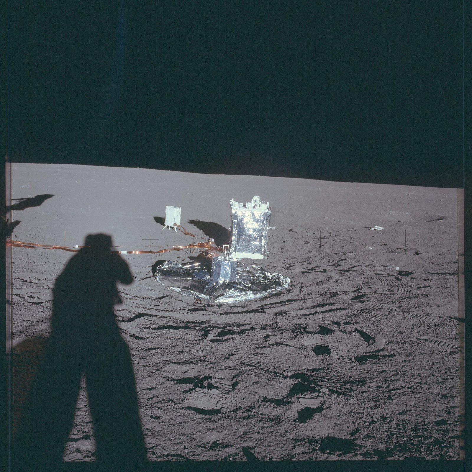 Apollo 12 surface photo of the ALSEP science station, with the Passive Seismic Experiment in the foreground on the gray lunar soil